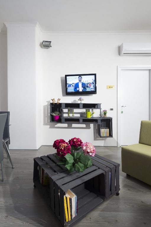 Televízia a/alebo spoločenská miestnosť v ubytovaní B&B Sleep & Zupp
