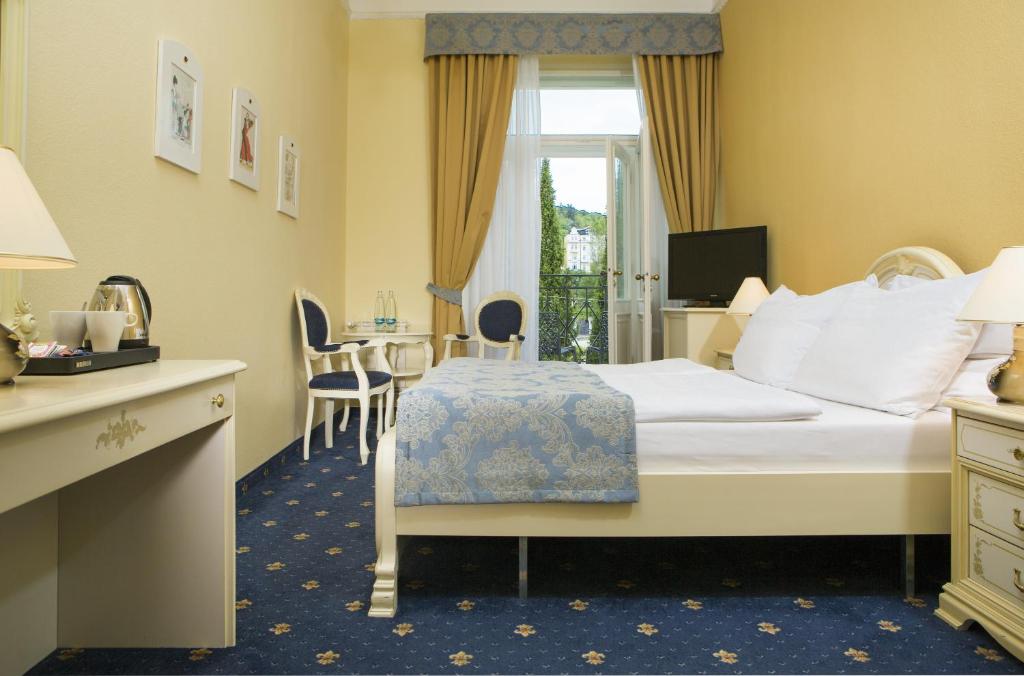 Postel nebo postele na pokoji v ubytování OREA Spa Hotel Palace Zvon Mariánské Lázně