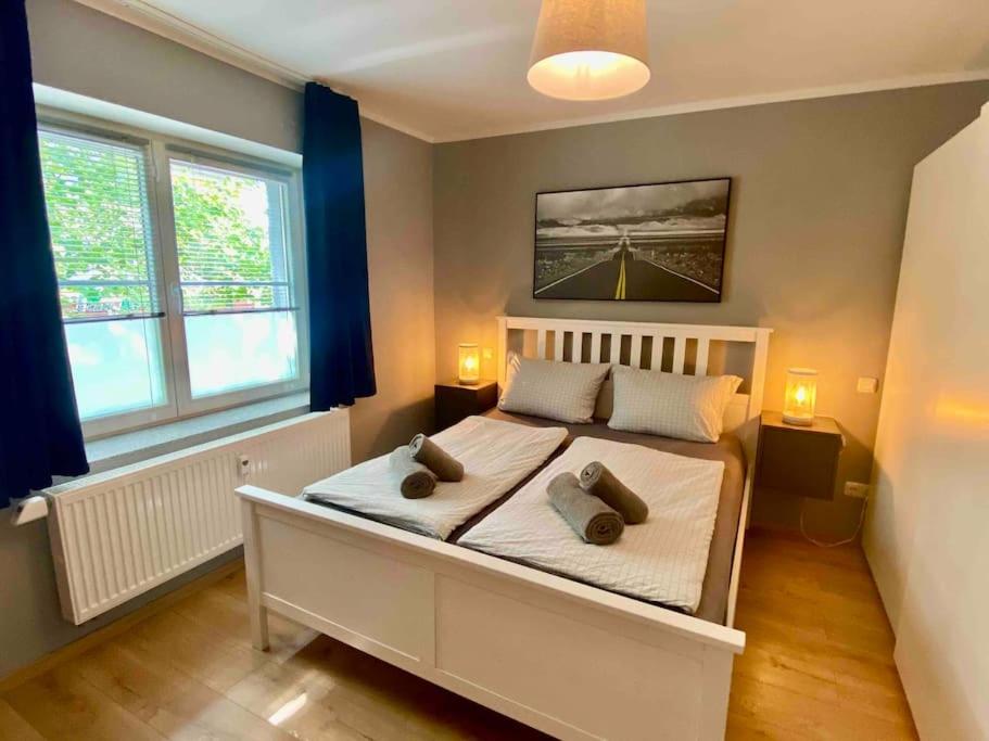 a bedroom with a bed with two pillows on it at Apartment in Potsdam-Babelsberg in Potsdam