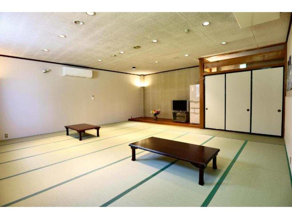 a large room with a ping pong table in it at Hakuba park hotel - Vacation STAY 96005v in Hakuba