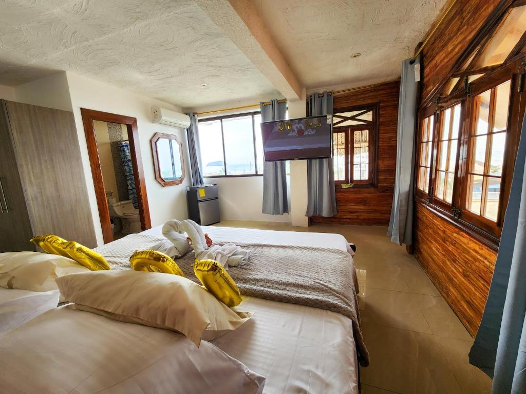 Postel nebo postele na pokoji v ubytování Hostal Poseidon