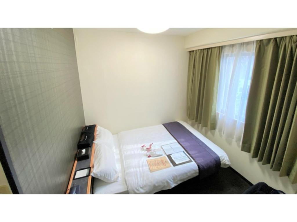Posteľ alebo postele v izbe v ubytovaní Hotel Area One Oita - Vacation STAY 99748v