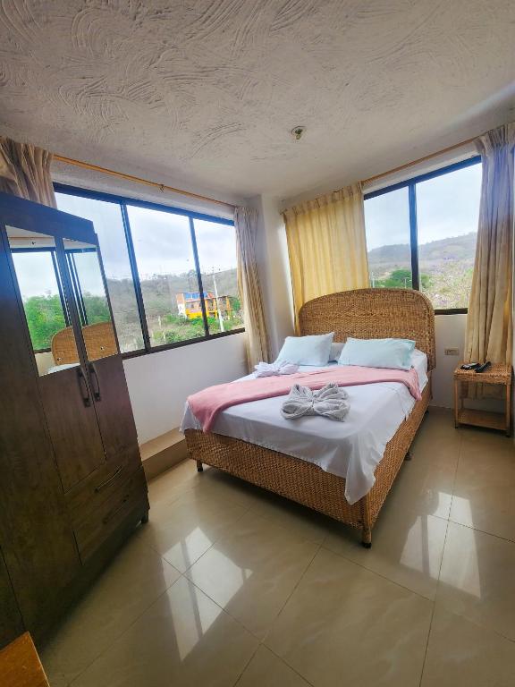 Postel nebo postele na pokoji v ubytování Hostal Poseidon