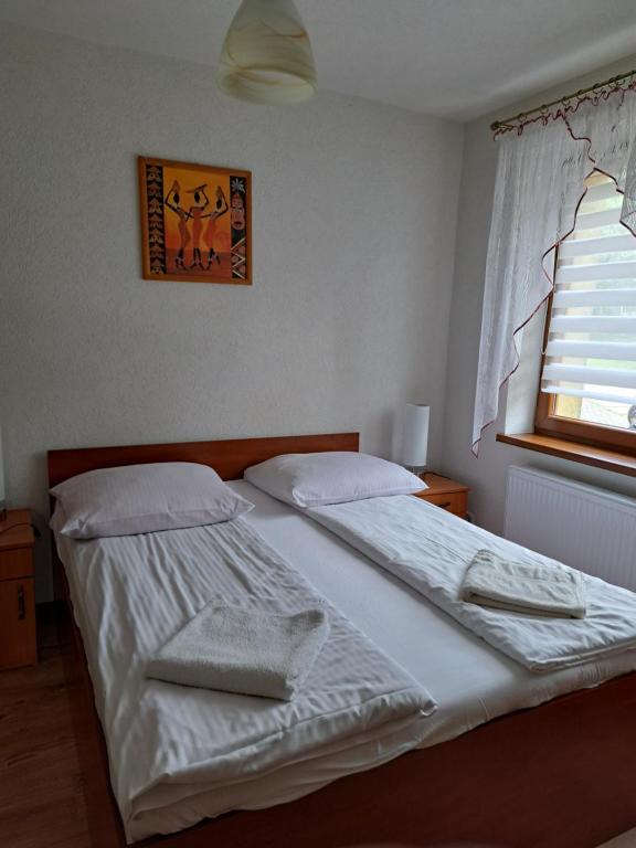 Postel nebo postele na pokoji v ubytování Willa Melisa