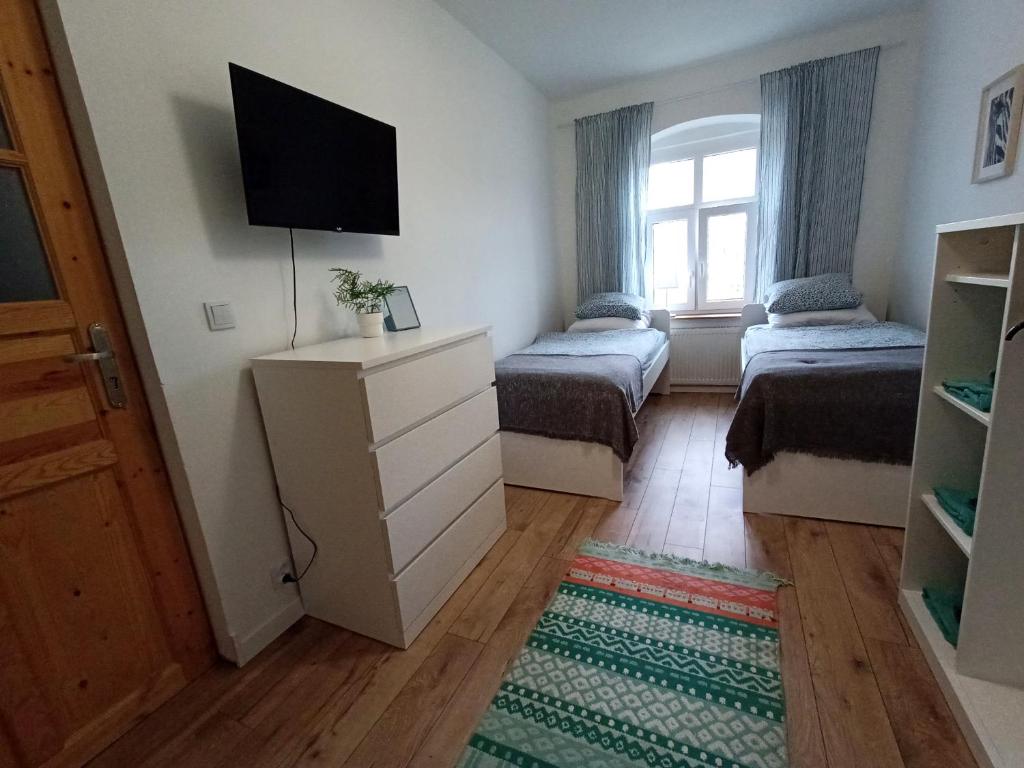 Postel nebo postele na pokoji v ubytování Lemuria Hostel Szkolna centrum