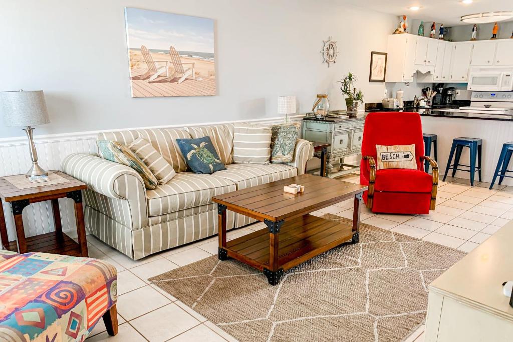 a living room with a couch and a table at Healing Hideaway in Saint Joe Beach
