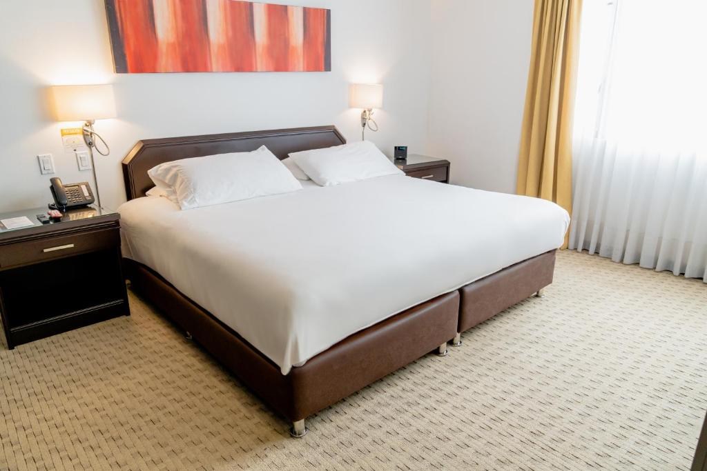 Postel nebo postele na pokoji v ubytování Hotel 101 Park House