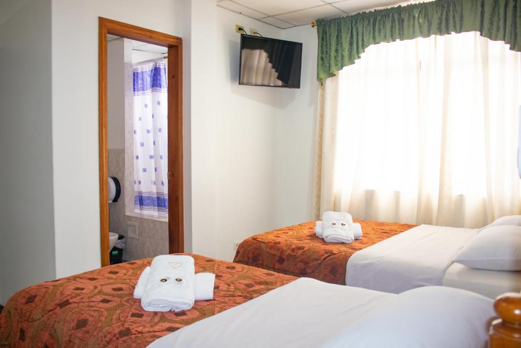 Postel nebo postele na pokoji v ubytování Hotel Colonial