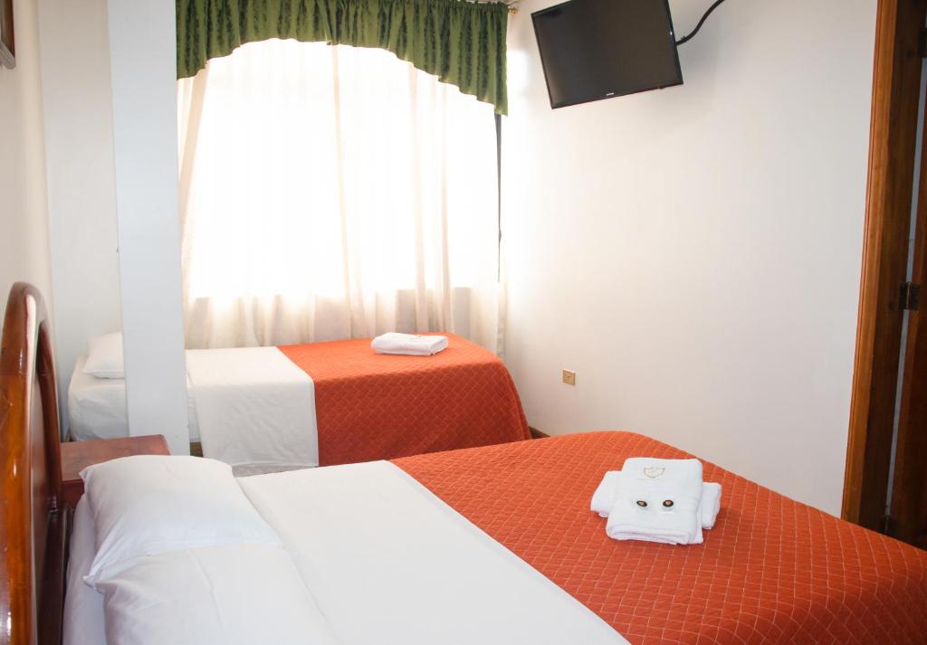 Postel nebo postele na pokoji v ubytování Hotel Colonial