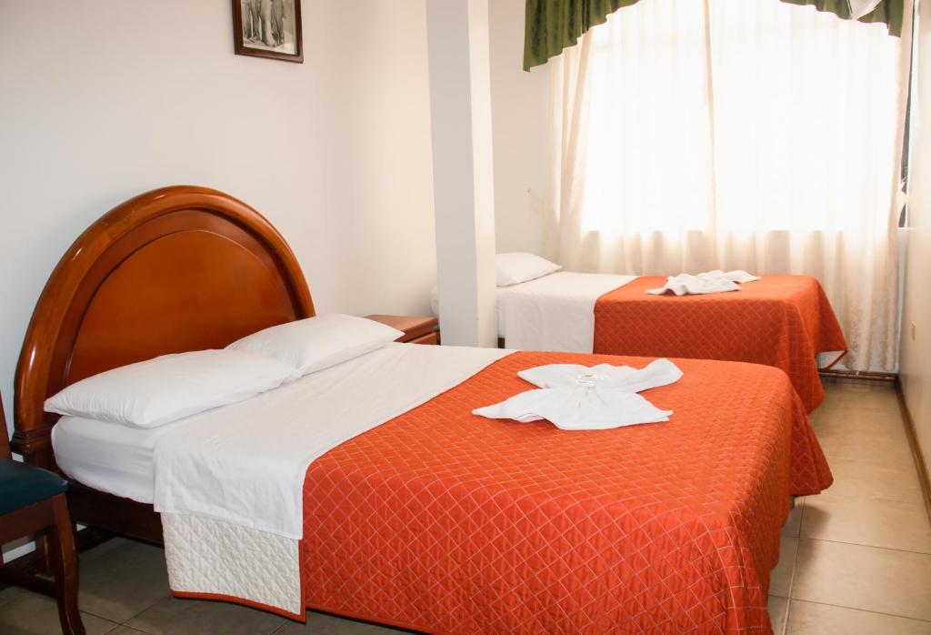 Postel nebo postele na pokoji v ubytování Hotel Colonial
