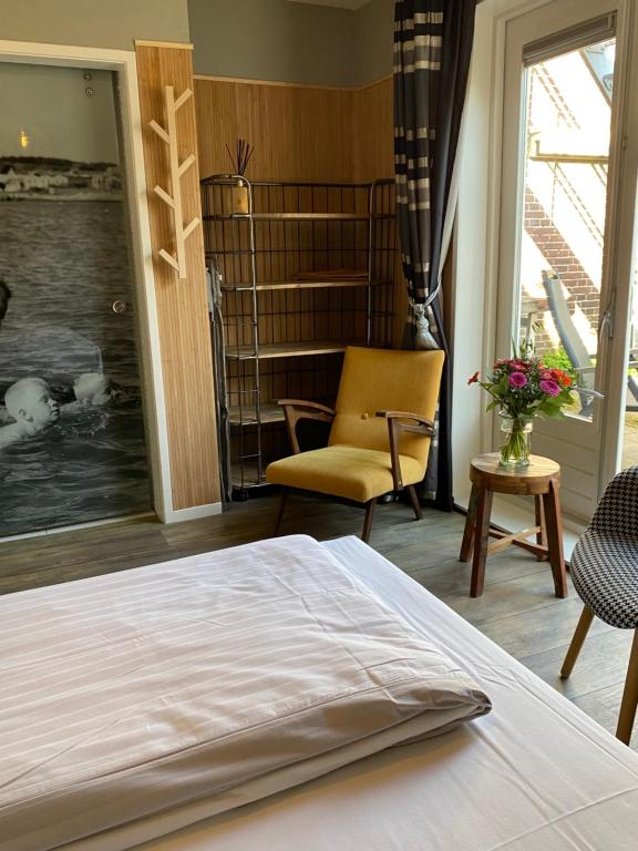 Postel nebo postele na pokoji v ubytování Hotel Buren