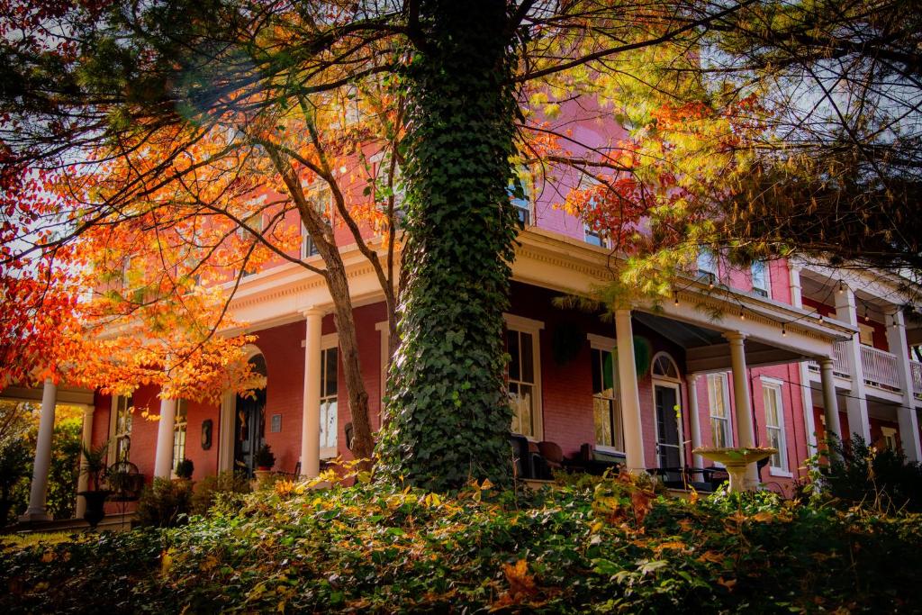 a large house with a tree in front of it at The Hollinger House in Lancaster