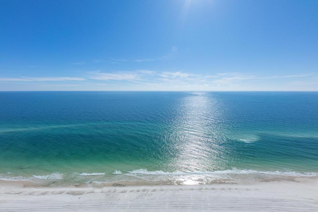 an aerial view of a beach with the ocean at The Bluebird OBA at Phoenix West II in Orange Beach