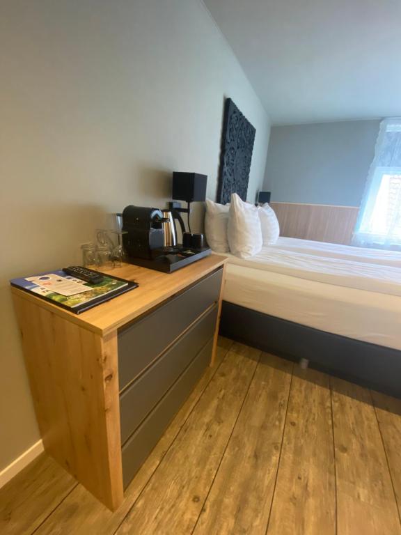 Postel nebo postele na pokoji v ubytování Hotel Buren