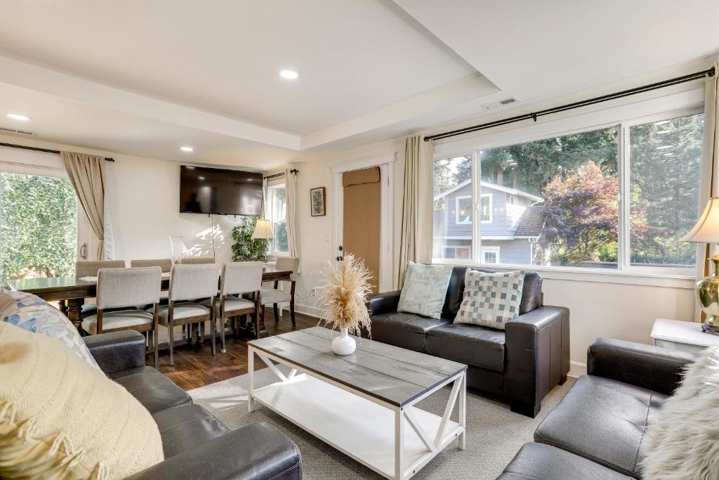 a living room with couches and a dining room at Lovely Redmond Home about 17 Mi to Downtown Seattle! in Redmond