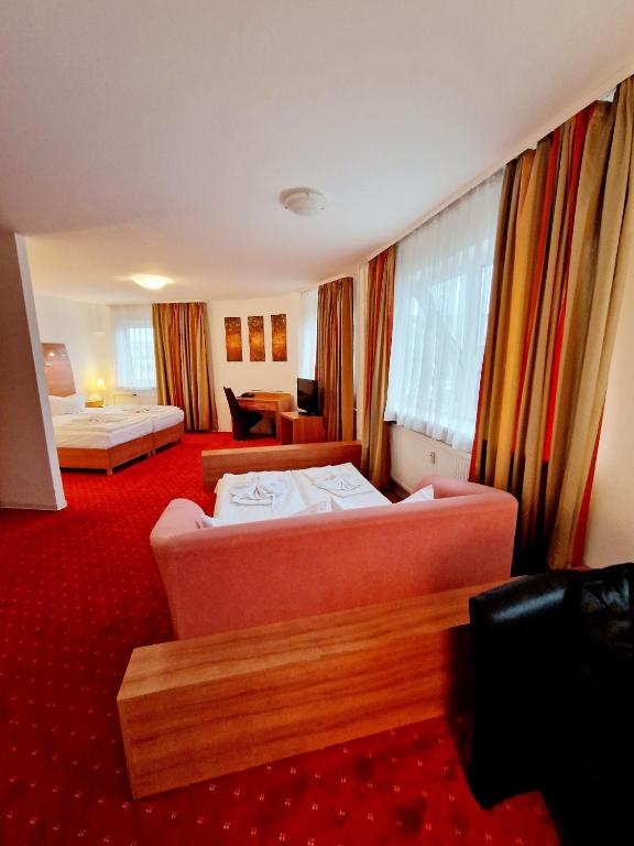 Postel nebo postele na pokoji v ubytování Hotel Kaiser