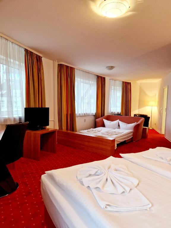 Postel nebo postele na pokoji v ubytování Hotel Kaiser