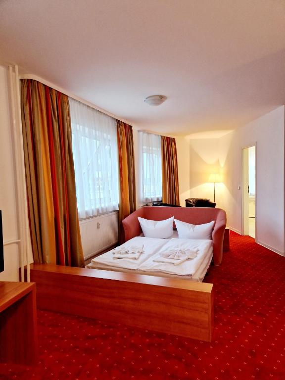 Postel nebo postele na pokoji v ubytování Hotel Kaiser