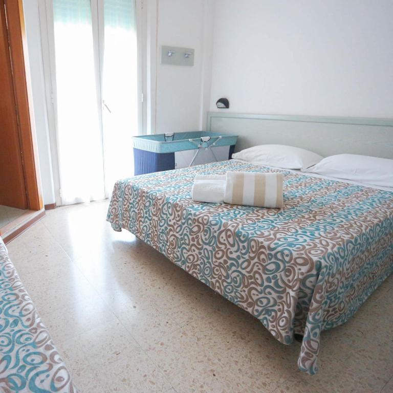 Postel nebo postele na pokoji v ubytování Hotel leonardo
