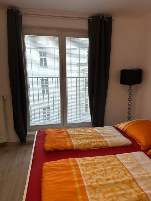 Łóżko lub łóżka w pokoju w obiekcie Apartment opera