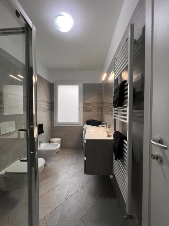 a bathroom with a sink and a toilet and a shower at Venezia Beach in Chioggia