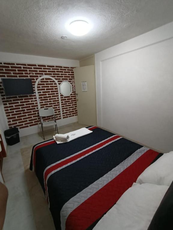 Postel nebo postele na pokoji v ubytování Hotel Fer