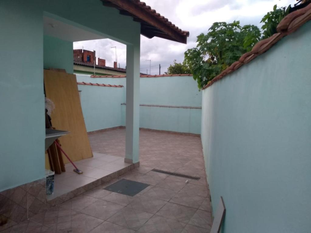 a view from the outside of a house with a patio at casa na praia Itanhaém in Guarulhos