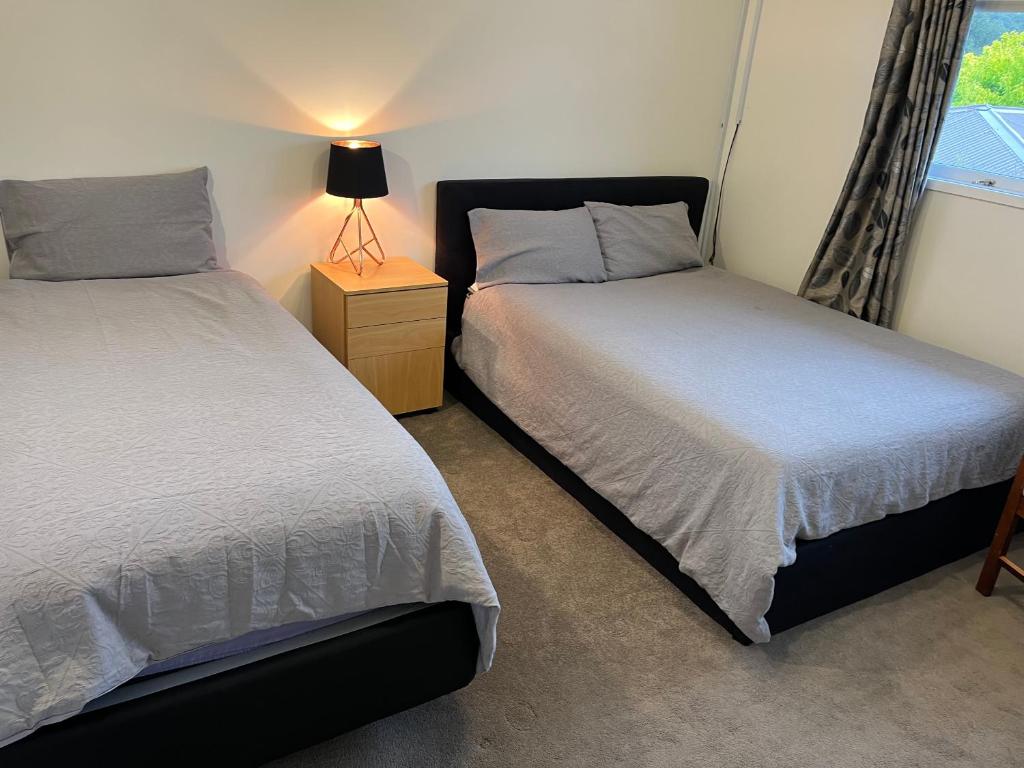 Postel nebo postele na pokoji v ubytování Hillcrest Homestay, NorthShore, Auckland