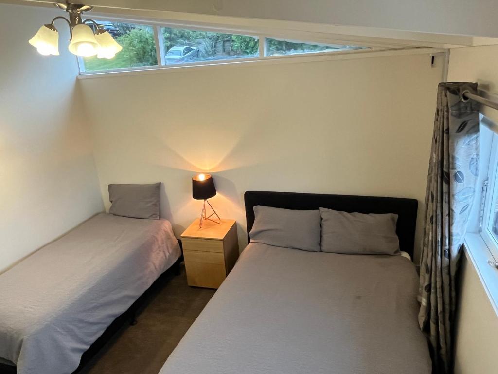 Postel nebo postele na pokoji v ubytování Hillcrest Homestay, NorthShore, Auckland