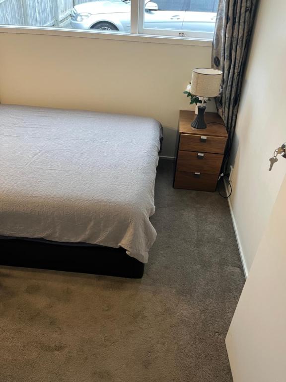 Postel nebo postele na pokoji v ubytování Hillcrest Homestay, NorthShore, Auckland
