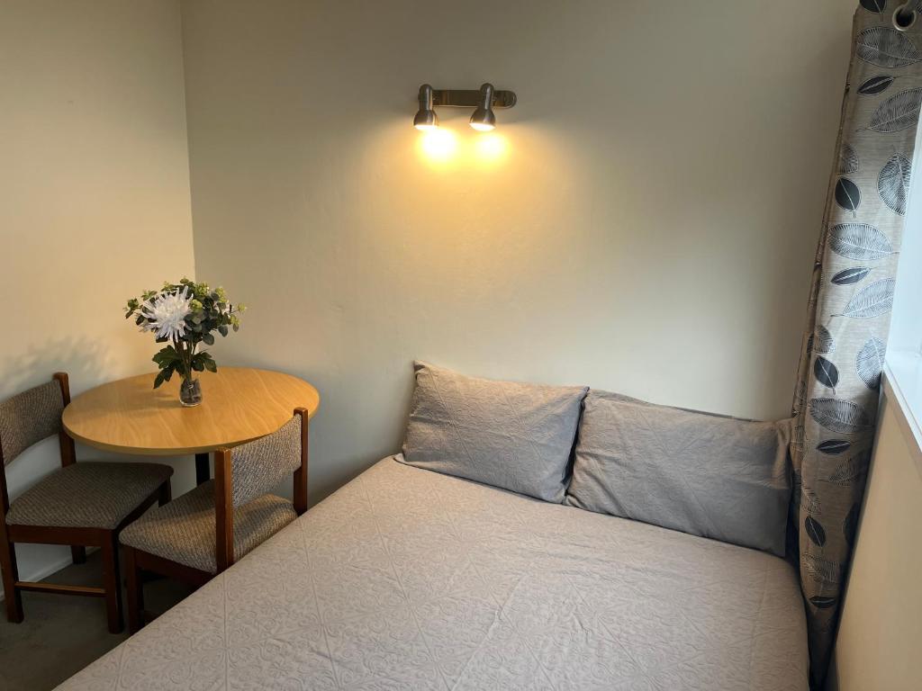 Postel nebo postele na pokoji v ubytování Hillcrest Homestay, NorthShore, Auckland