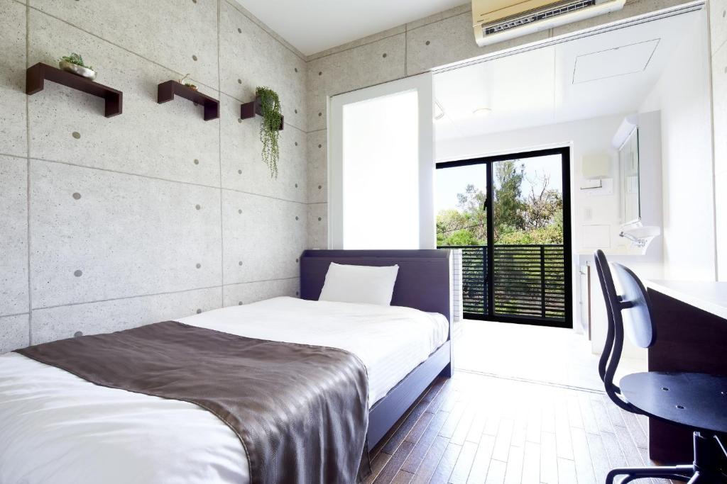 Un pat sau paturi într-o cameră la E-horizon Resort Condominium Sesoko - Vacation STAY 92297v