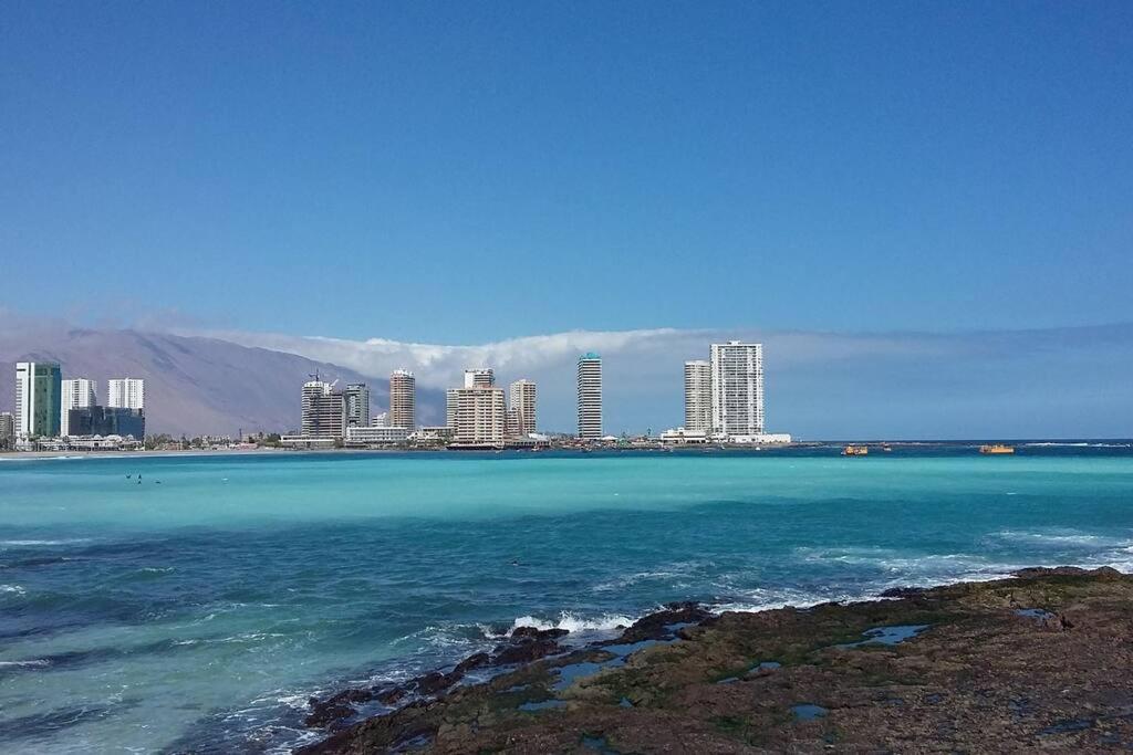 a view of a city from the ocean with buildings at Departamento a pasos de Cavancha in Iquique
