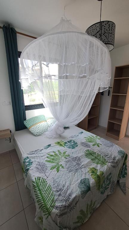 Postel nebo postele na pokoji v ubytování La Kay Jade