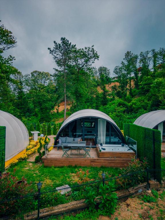 a dome tent with a deck in a field at SNAİL HOUSE SAPANCA in Sapanca