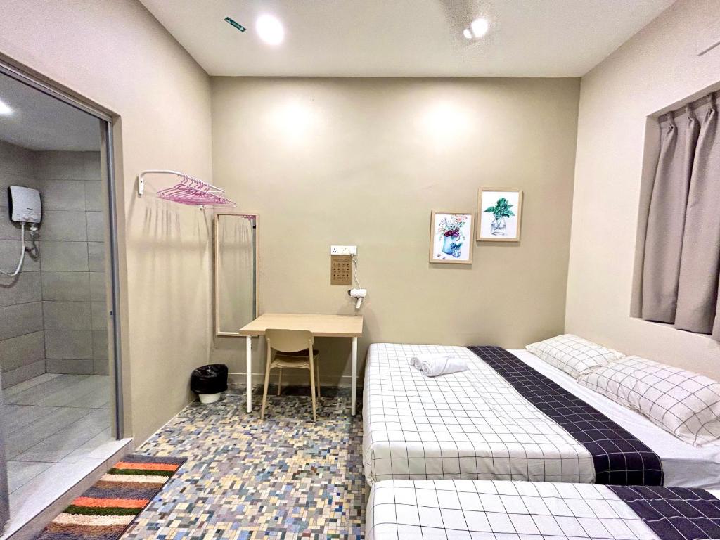 a bedroom with a bed and a desk and a shower at myROOM @ Mandalay Georgetown, Off Jln Burma, Gurney Drive in George Town