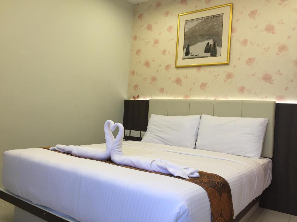 Postel nebo postele na pokoji v ubytování Louis Hotel