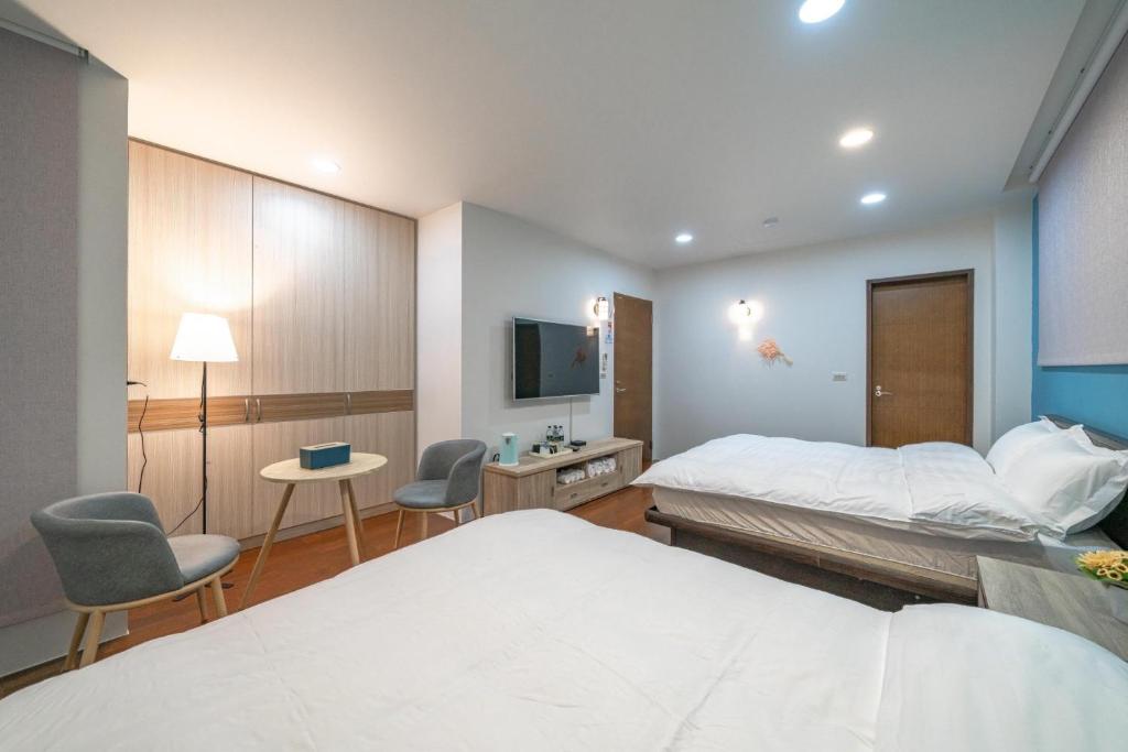 Postel nebo postele na pokoji v ubytování Luodong warm house