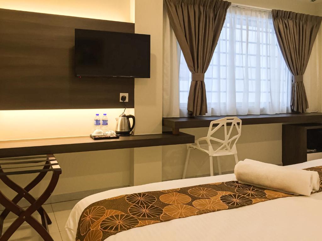 Postel nebo postele na pokoji v ubytování Louis Hotel