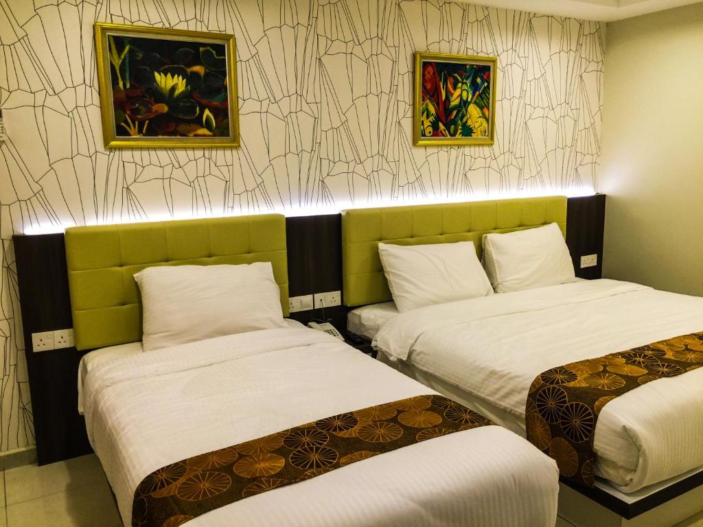 Postel nebo postele na pokoji v ubytování Louis Hotel