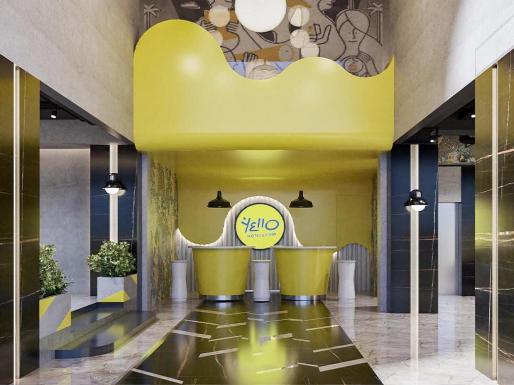 a lobby of a hotel with a yellow ceiling at Yello Hotel Harbour Bay in Nagoya
