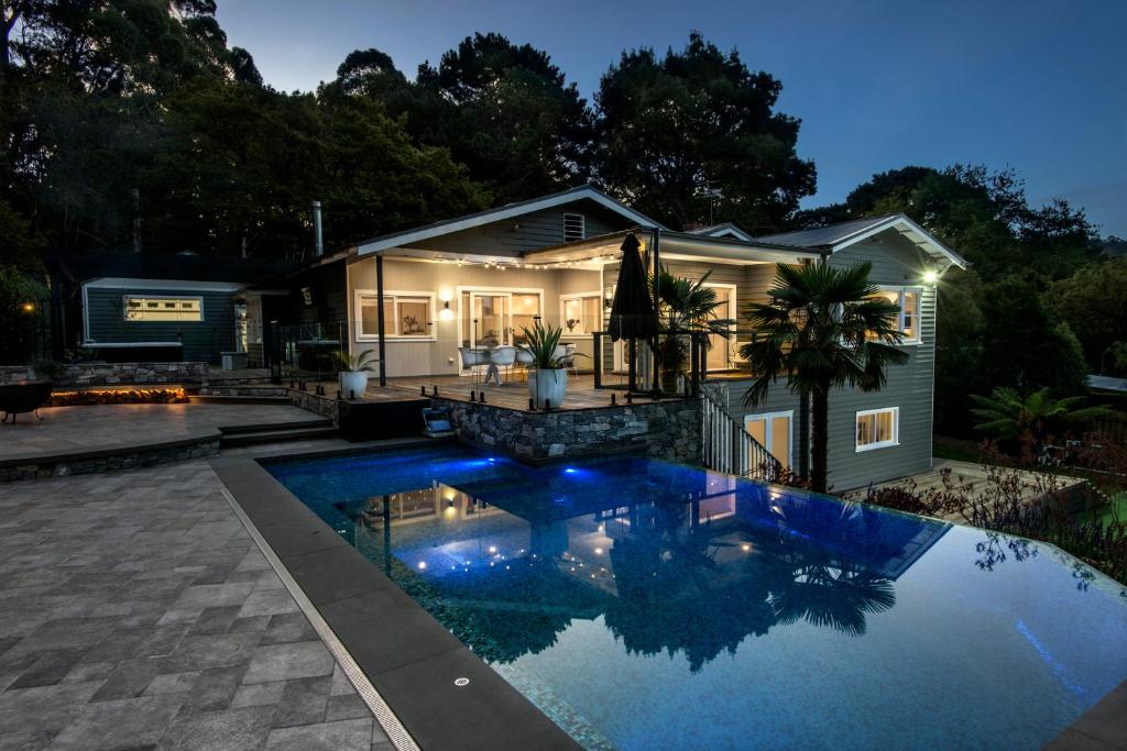 a house with a swimming pool in front of a house at Luxury Resort Style in Olinda - Greenways in Olinda