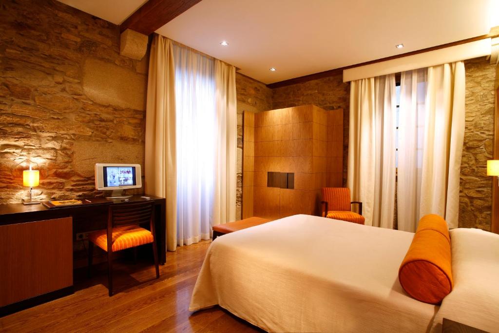 Postel nebo postele na pokoji v ubytování Hotel Altaïr