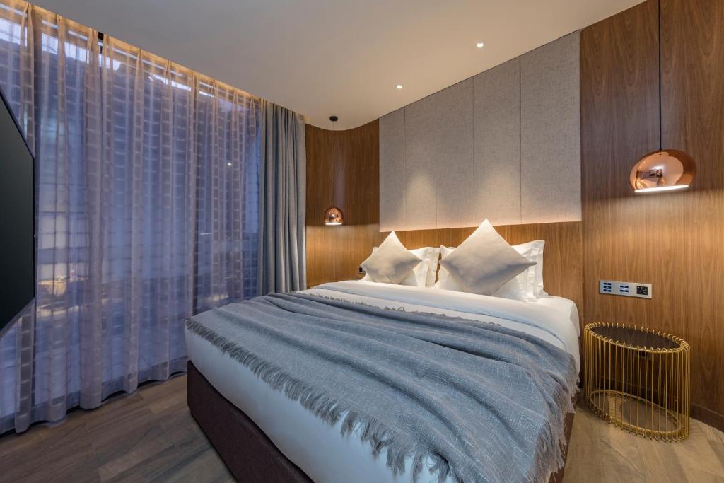 Postel nebo postele na pokoji v ubytování Hangshe Hostel Fuzhou