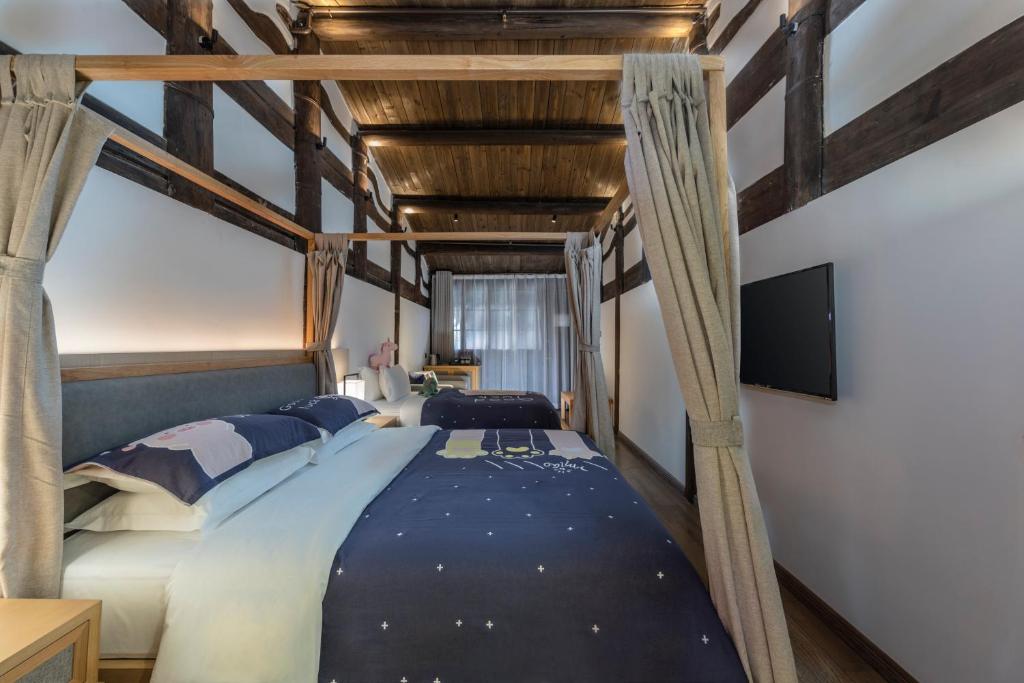 Postel nebo postele na pokoji v ubytování Hangshe Hostel Fuzhou