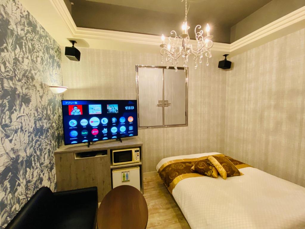 TV a/nebo společenská místnost v ubytování Hotel Crystal -adult only-