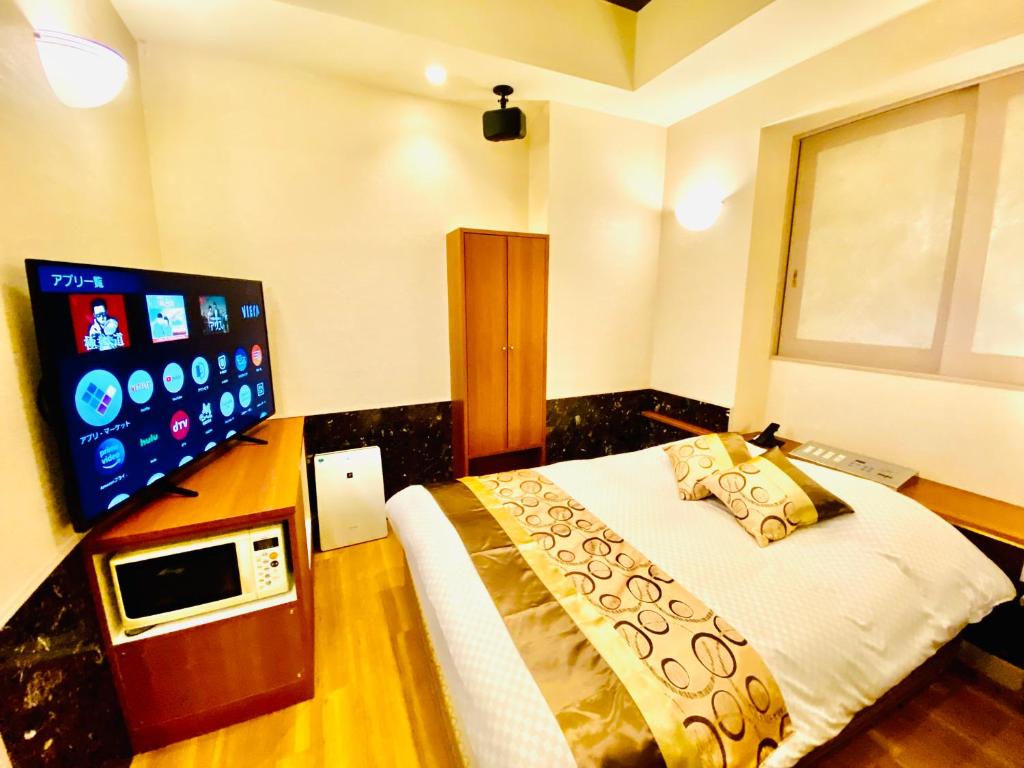 TV a/nebo společenská místnost v ubytování Hotel Crystal -adult only-