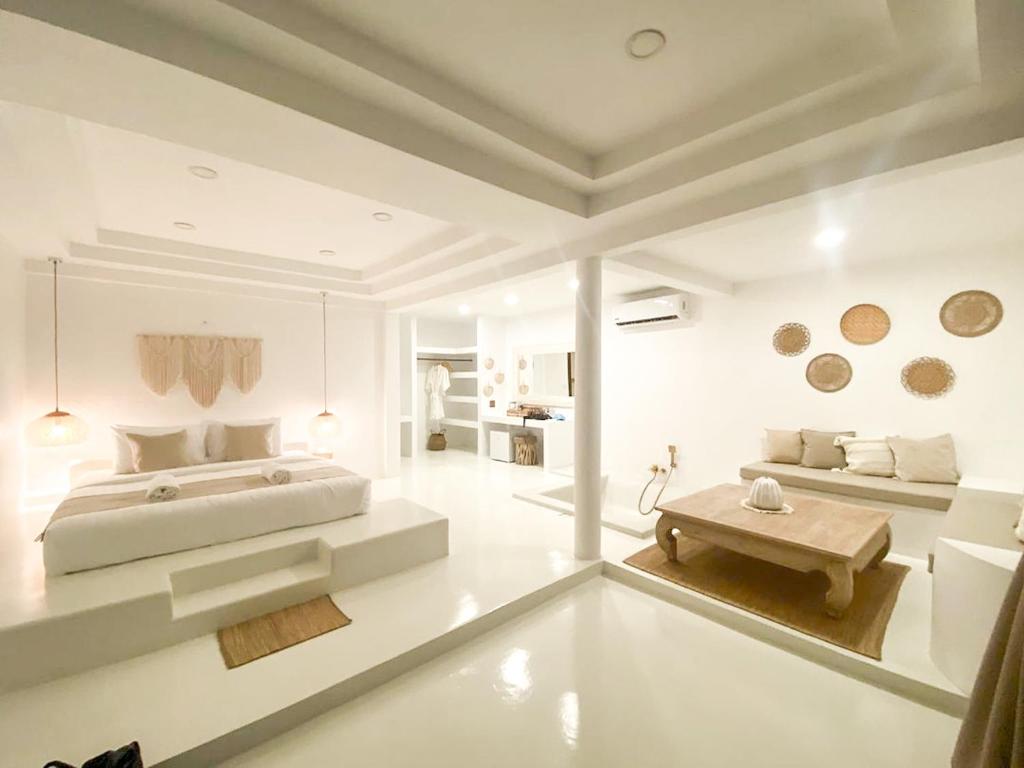 Postel nebo postele na pokoji v ubytování Elephant Beach Club & Resort Samui