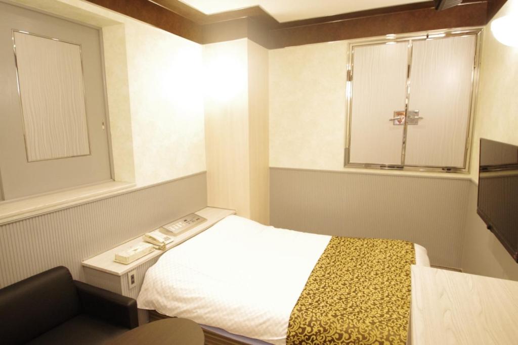 Postel nebo postele na pokoji v ubytování Hotel Crystal -adult only-