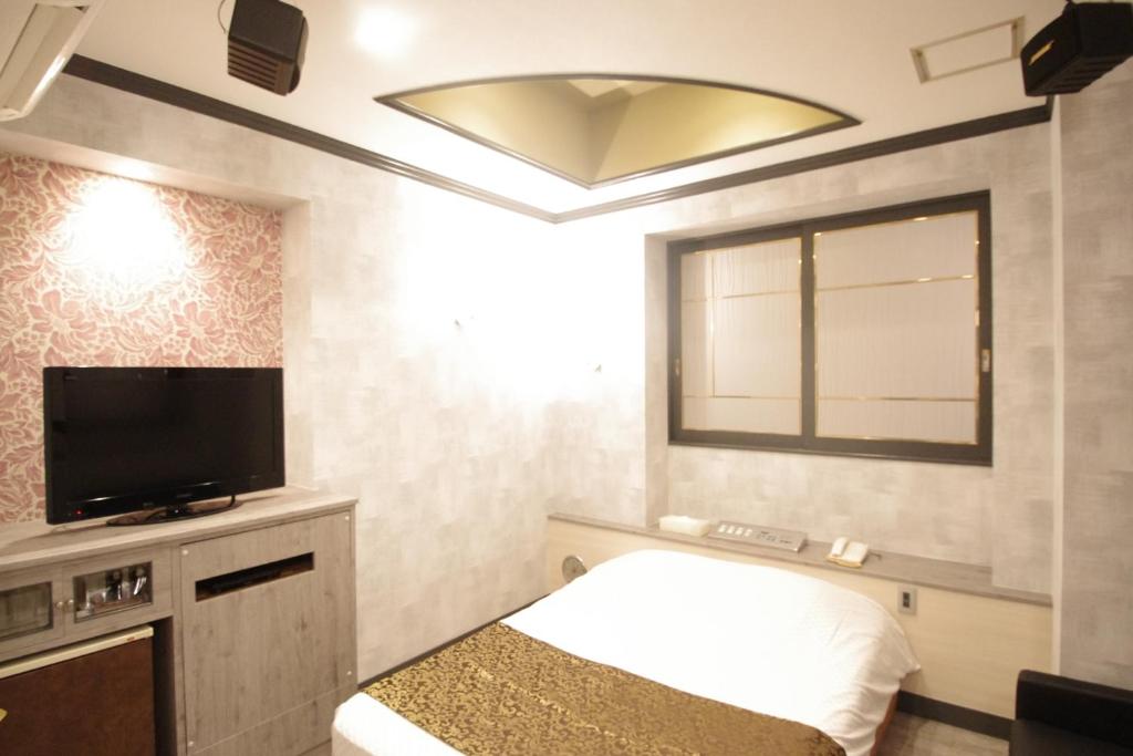 Kuchyň nebo kuchyňský kout v ubytování Hotel Crystal -adult only-